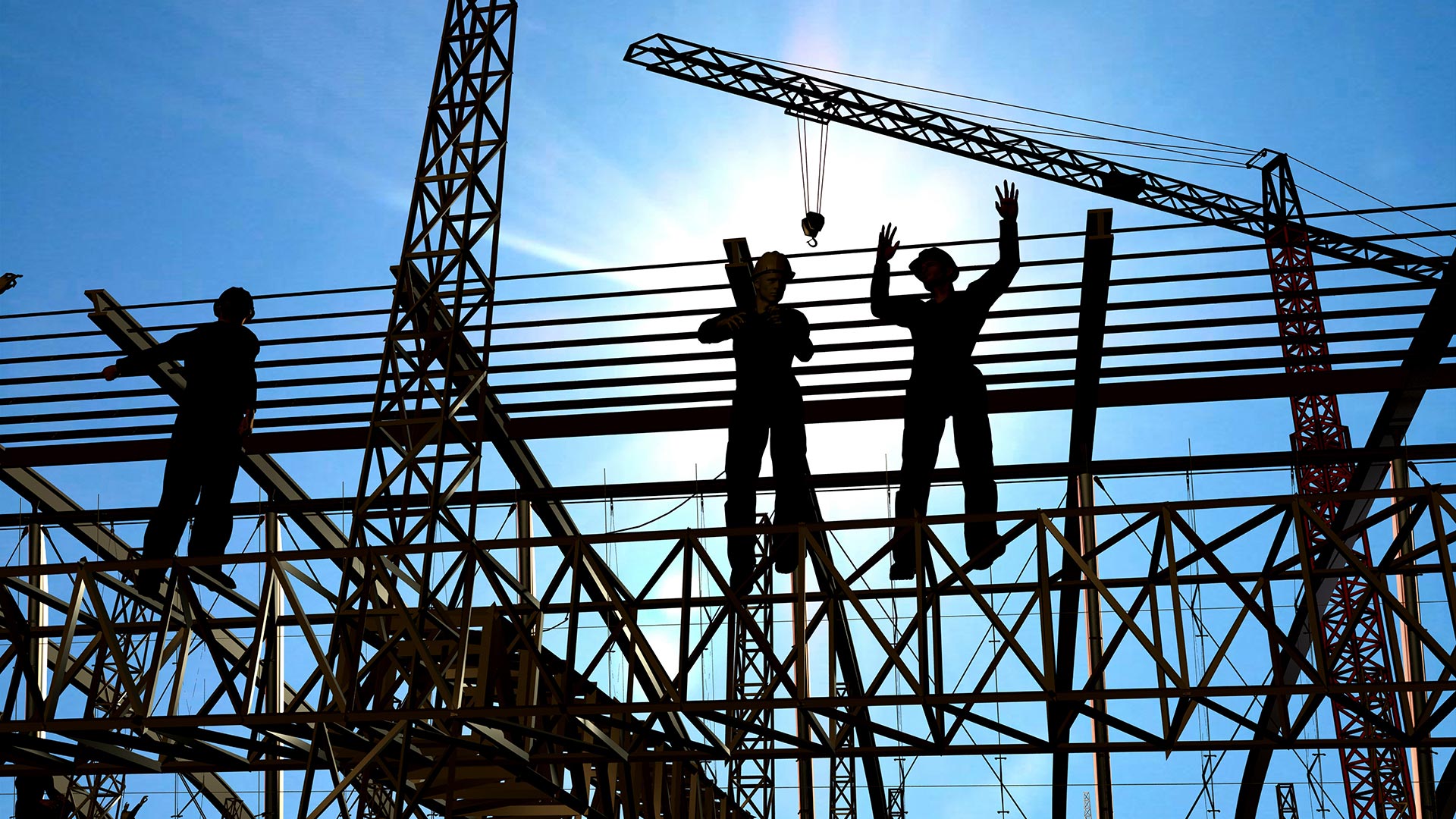 Construction workers onsite atop a steel structure.
